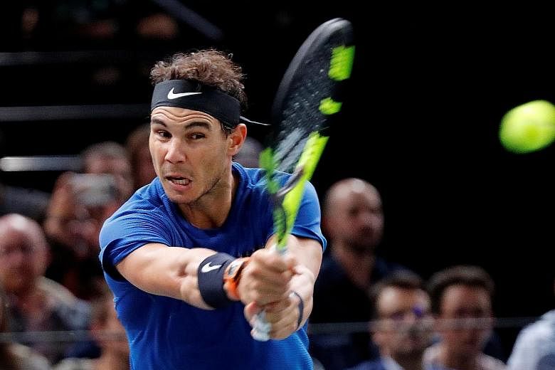 Rafael Nadal in action against Pablo Cuevas during the third round of the Paris Masters. The world No. 1 is in doubt for the Tour Finals.