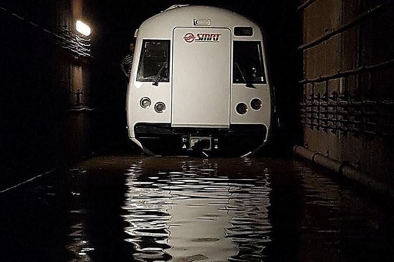 A train in the flooded tunnel between the Bishan and Braddell MRT stations on Oct 7. The flooding, caused by a gap in maintenance operations, disrupted North-South Line train services for about 20 hours.