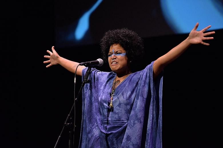 Poet-musician Deborah Emmanuel performing festival-commissioned song Ocean Free at the opening of the Singapore Writers Festival yesterday.