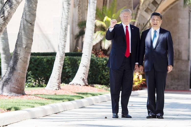 US President Donald Trump and his Chinese counterpart Xi Jinping in West Palm Beach, Florida, in April. The writer says Asian leaders can see that Mr Trump is becoming politically weaker at a moment of historic strength and confidence for Mr Xi.