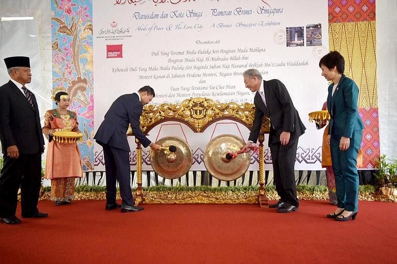 Brunei's Crown Prince Haji Al-Muhtadee Billah (left) and Singapore's Deputy Prime Minister Teo Chee Hean as well as Ms Grace Fu, Minister for Culture, Community and Youth, at the launch of the exhibition on the two countries' relations yesterday.
