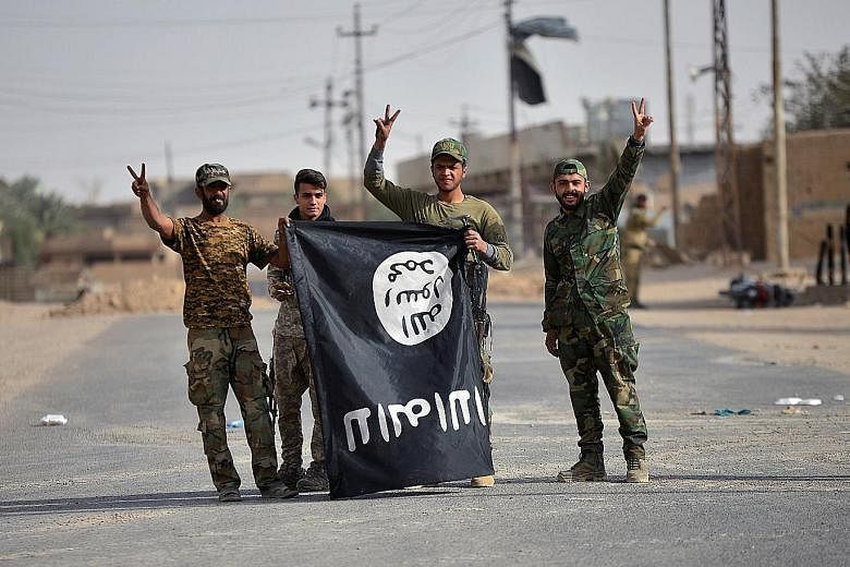 On Friday, Iraqi forces, including the Popular Mobilisation Forces (above), took the Iraqi border town of Al-Qaim, near Albu Kamal, from ISIS. Though small, Al-Qaim has been an important town for ISIS, used as a safe destination for its top commander