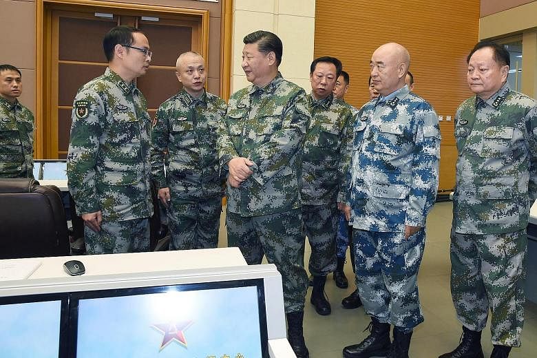 Chinese President Xi Jinping (centre), who is also chairman of the Central Military Commission, visiting a joint battle command centre in Beijing last Friday, where he issued a directive to the People's Liberation Army high command to "work hard at c