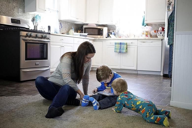 Nurse Staci Burns' three-year-old son, Isaac (centre), chanced on a clip on YouTube Kids that featured renderings of the popular Paw Patrol rescue dogs caught in a nightmarish situation. With them is her younger son, Asher, 10 months.