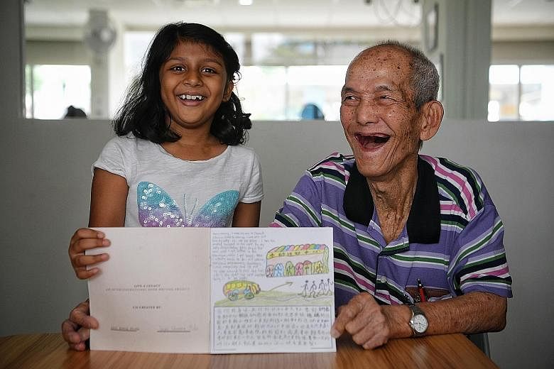 Primary 2 pupil Dayna Shanaia Maha and retiree Ang Peng Hong co-wrote a book about the importance of being happy.