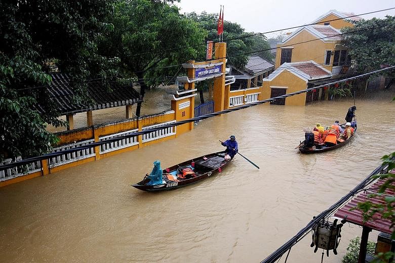 A flooded street in Hoi An yesterday. The spouses of world leaders who will attend the Apec summit in nearby Danang were set to visit the Unesco World Heritage Site later this week, but it is unclear whether the visit will proceed.