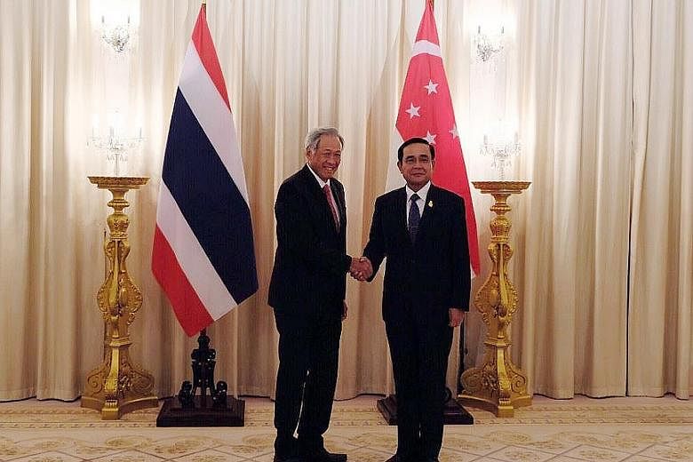 Defence Minister Ng Eng Hen meeting Thai Prime Minister Prayut Chan-o-cha at the Government House in Bangkok yesterday.