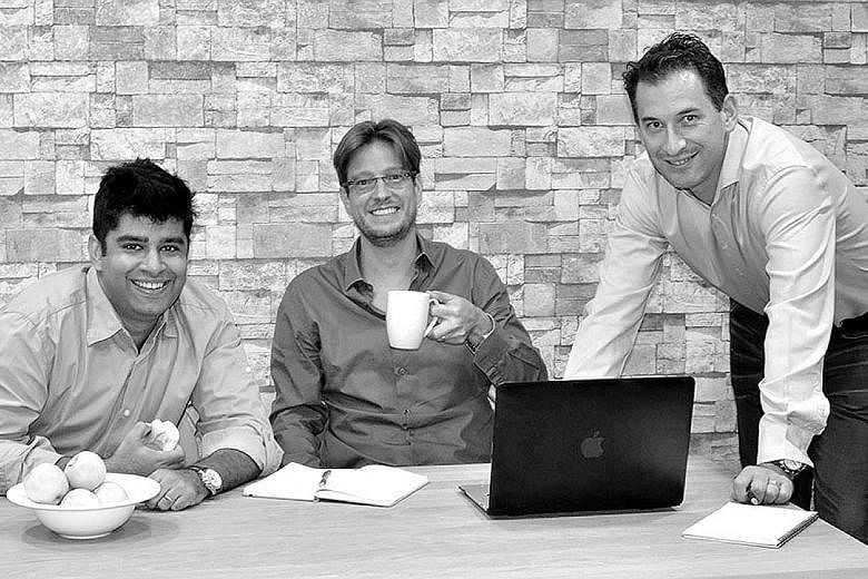 Smartkarma co-founders (from far left) Raghav Kapoor, Jon Foster and Lee Mitchell. The firm said the Series B round of financing brings its total funding to US$21 million (S$28.6 million).