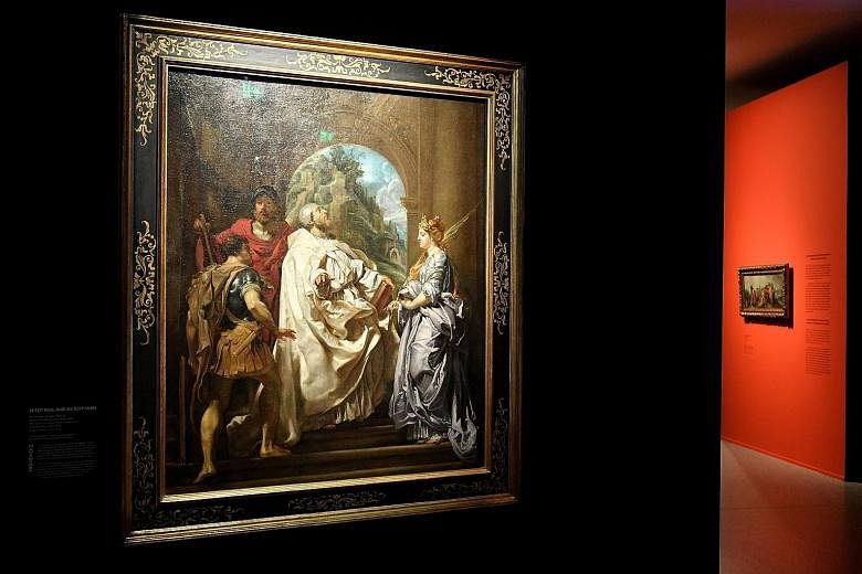 The Saints Gregory, Maurus, And Papianus And Domitilla by Flemish artist Peter Paul Rubens is on display in the exhibition at the Bundeskunsthalle in Bonn, Germany.