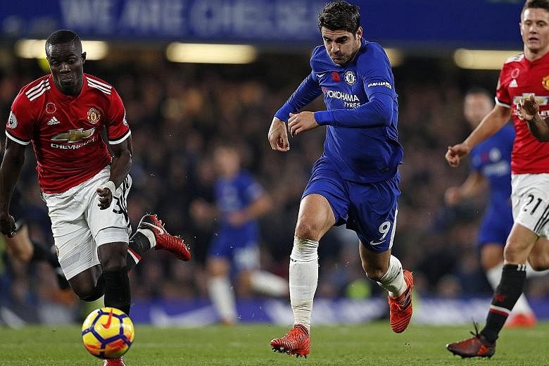 Chelsea striker Alvaro Morata (No. 9) retains possession as Eric Bailly of Manchester United attempts to match him for pace during the Blues' 1-0 victory at Stamford Bridge on Sunday. The Spaniard scored the only goal of the match, his first goal sin