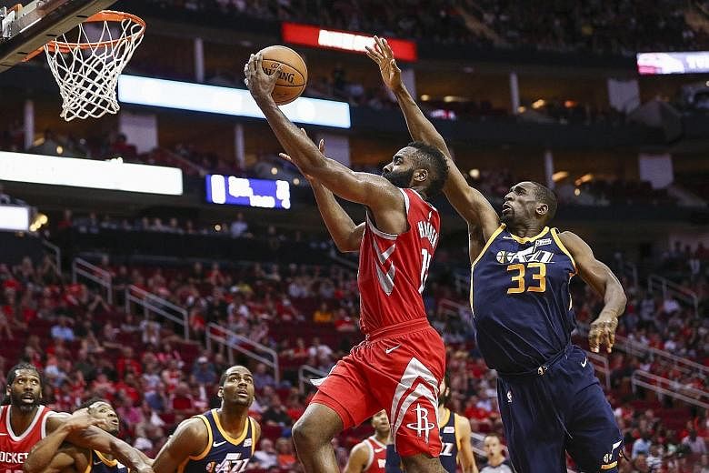 Houston Rockets' James Harden scoring on a lay-up against the Utah Jazz. The guard could not be contained, with 56 points in just 35 minutes.