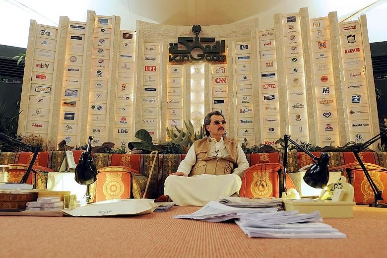 Saudi Prince Alwaleed bin Talal sitting inside his desert camp near Riyadh, Saudi Arabia, in 2010. He has sizeable stakes in Twitter, Lyft and Citigroup and has gone into business with some of the corporate world's biggest titans, including Mr Bill G