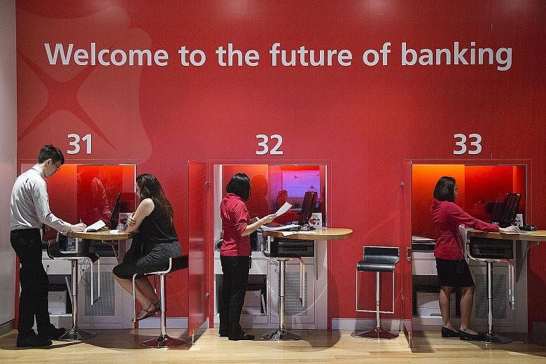 A DBS outlet in Singapore. The bank is finally taking the broom to its exposure to troubled borrowers in the oil services sector with a $1.65 billion loss provision in its latest financial results, says the writer.