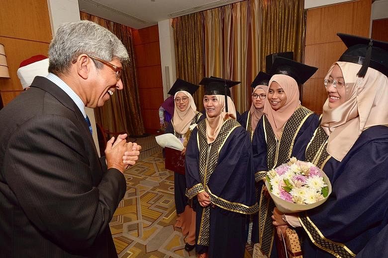 Minister-in-charge of Muslim Affairs Yaacob Ibrahim speaking with graduates from the Al-Azhar University, in Cairo, on Sunday. He said Singapore needed strong religious leaders who "possess an expansive worldview".
