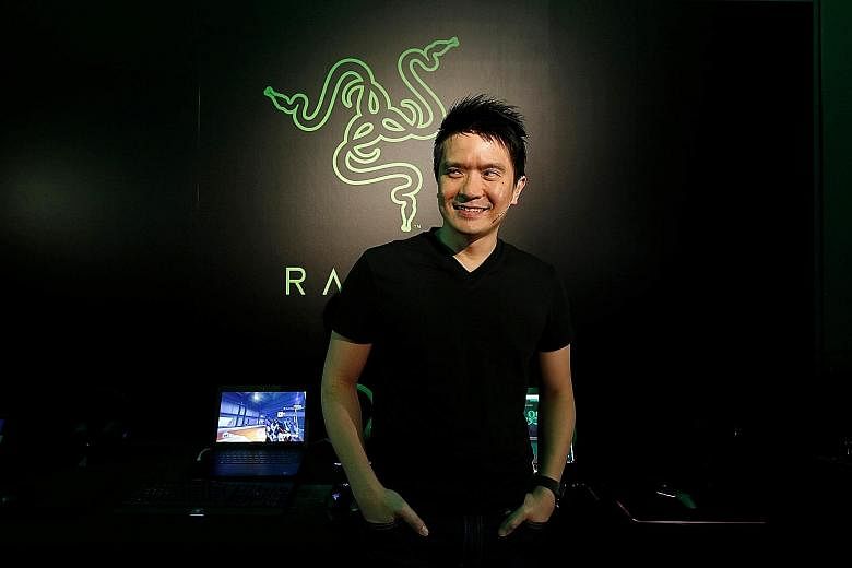 Razer co-founder and CEO Tan Min-Liang at a news conference last month ahead of the firm's IPO in Hong Kong. The Hong Kong public tranche was 289 times oversubscribed, with 21 million people placing orders, local media reported. Mr Li Ka Shing, Hong 