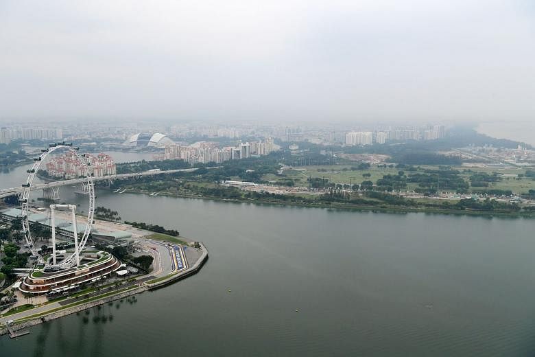 Hazy skies over Singapore as seen from Marina Bay Sands on Oct 25. The writers say that, in tandem with Indonesia's efforts to curb haze, Singapore must address its own local sources of air pollution.
