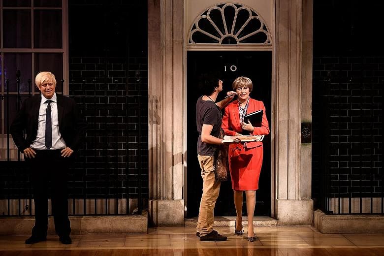 A wax figure of British Prime Minister Theresa May, stepping out of No. 10, Downing Street, in a red power suit and leopard-skin kitten-heeled shoes, was unveiled by wax museum Madame Tussauds yesterday. Also unveiled was the wax likeness of British 