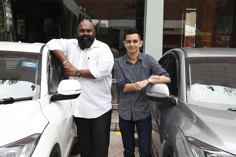 Uber drivers Bear Gunashagran (in white shirt) and Ryan Brown are pleased with the initiatives rolled out by the company.