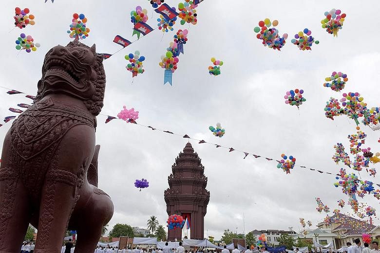 Balloons - along with doves - were released at the Independence Monument during a ceremony marking Cambodia's independence day in Phnom Penh yesterday.