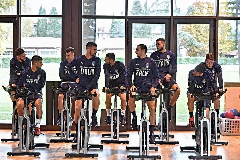 The Italian football team go through their paces in the gym at their training base in Florence. The Azzurri may revert to an old tried-and-trusted system of three at the back to shut out Sweden and seal qualification.