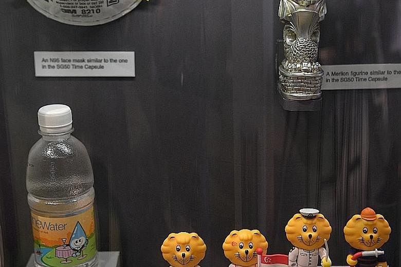 A Citizen Blackie watch (left). Singa the Lion figurines (right). The Super Simon game was considered cutting-edge technology in its time. Phone cards with advertisements and photos on them. A push-button telephone.