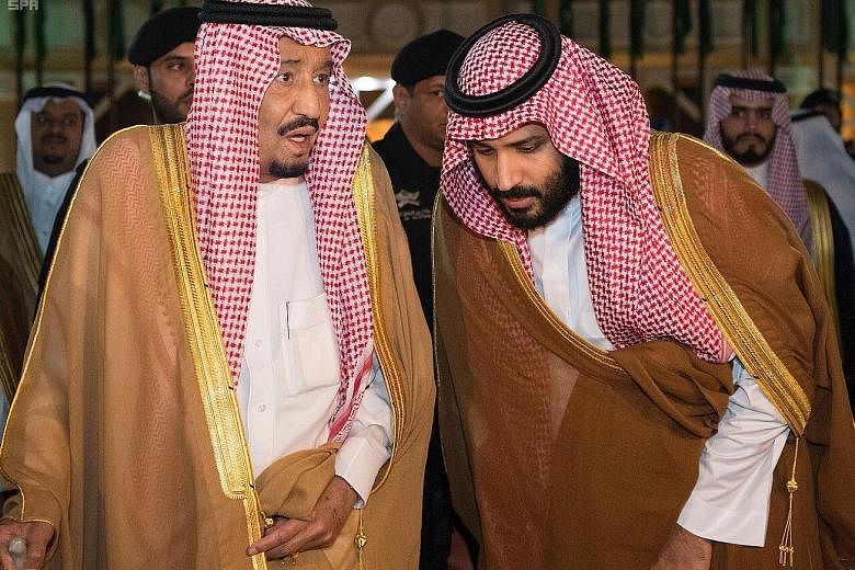 Saudi Arabia's Crown Prince Mohammed bin Salman (right) chatting with his father, King Salman bin Abdulaziz Al Saud, before King Salman left for Medina, in Riyadh, Saudi Arabia, on Wednesday.