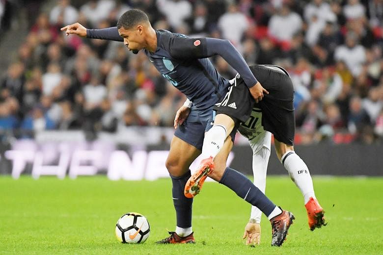 England midfielder Ruben Loftus-Cheek brushing off Germany's Mesut Ozil in a goalless friendly at Wembley on Friday. The 21-year-old debutant put on an impressive display in the middle of the park against the world champions to earn the Man-of-the-Ma