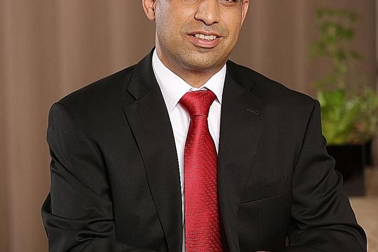 Mr Praveen Raina, senior vice-president, group operations and technology at OCBC Bank. He was one of the four tech enthusiasts who wanted to try building an app for the company five years ago - an initiative that has since become a key growth driver 
