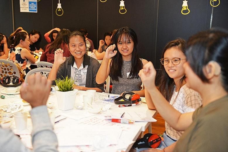 At the "Deaf Cafe", a concept developed by non-profit social enterprise Etch Empathy, participants use only sign language or writing to communicate, to better understand the lives of the deaf.