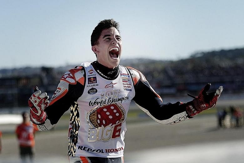 Honda rider Marc Marquez celebrating his fourth MotoGP world title in five years on home soil. The Spaniard, who missed out on the world crown in 2015, finished third at the season-ending Valencia Grand Prix yesterday.