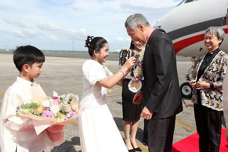 Prime Minister Lee Hsien Loong and Mrs Lee arriving at Clark in the Philippines yesterday. Mr Lee is slated to speak at the Asean-China Summit today, as Singapore is the country coordinator for Asean-China dialogue relations.