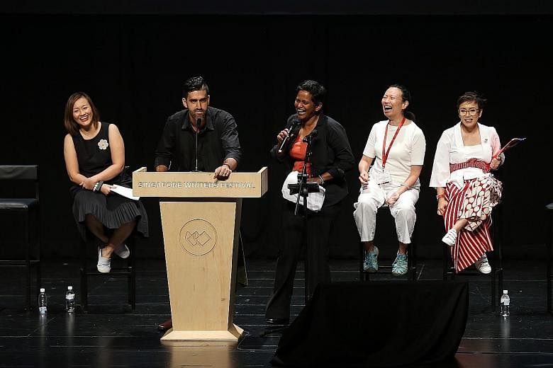 Shoppers at the book store at the Singapore Writers Festival at The Arts House yesterday. Debaters (from left) Petrina Kow, Rishi Budhrani, Shamini Flint, Ovidia Yu and Oniatta Effendi had the audience in stitches at the closing debate of the Singapo