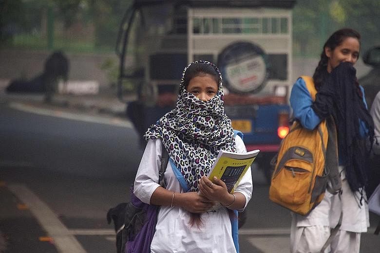 Schools reopened in New Delhi yesterday despite air pollution still hovering at emergency levels, drawing protests from parents in the Indian capital who said the move put children's health in jeopardy.