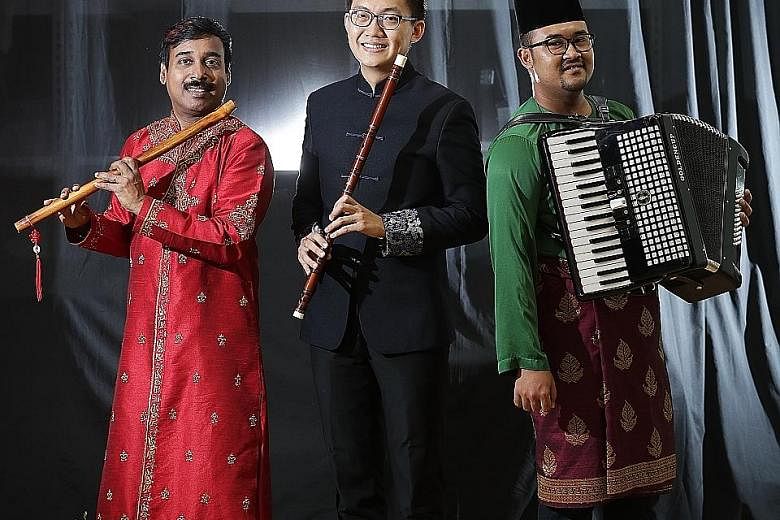 (From left) Ghanavenothan Retnam with his bansuri, Tan Qing Lun with his dizi and Megat Muhammad Firdaus Mohamed with his accordion.