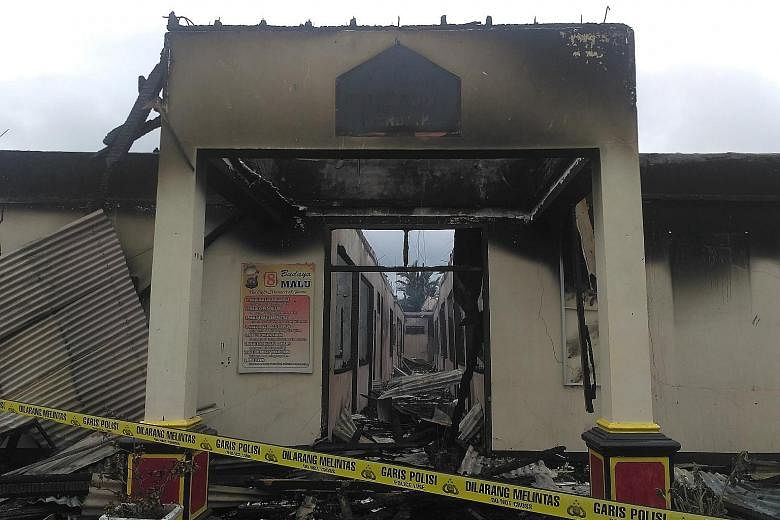 The razed police station complex in Dharmasraya regency in West Sumatra in Indonesia on Sunday. All the main buildings were burned to the ground but there were no casualties.