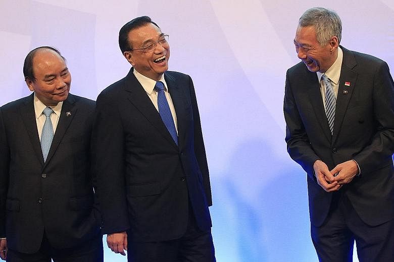 Prime Minister Lee Hsien Loong with Chinese Premier Li Keqiang (centre) and Vietnamese Prime Minister Nguyen Xuan Phuc at the Asean-China Summit in Manila yesterday.