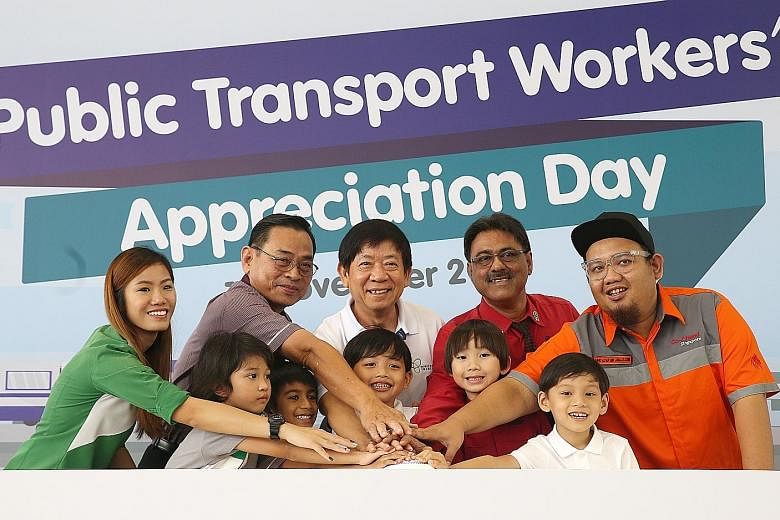 Transport Minister Khaw Boon Wan with representatives from the public transport operators - (from left) Ms Gena Goh (Tower Transit Singapore), Mr Lim Yew Huat (SBS Transit), Mr Charnjit Singh (SMRT) and Mr Muhammad Azan Jamalludin (Go-Ahead Singapore