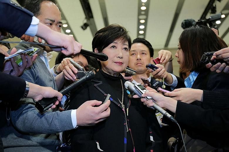 Ms Yuriko Koike speaking to reporters after saying she will step down as leader of Party of Hope in Tokyo yesterday. Ms Koike will be in Singapore for a three-day visit from today as part of the Lee Kuan Yew Exchange Fellowship programme.
