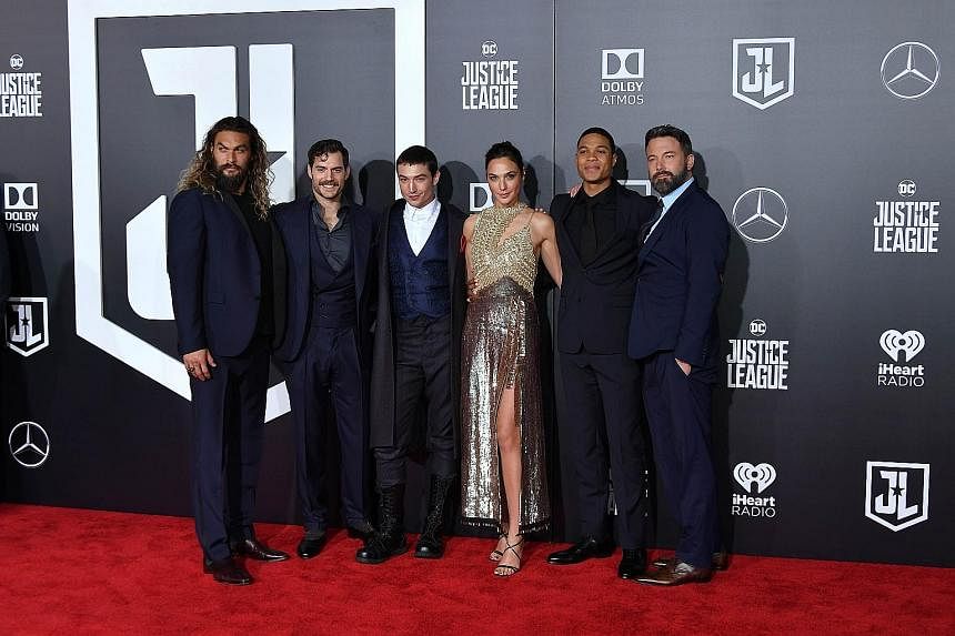 Superhero actors (from left) Jason Momoa (Aquaman), Henry Cavill (Superman), Ezra Miller (The Flash), Gal Gadot (Wonder Woman), Ray Fisher (Cyborg) and Ben Affleck (Batman) reunited at the world premiere of their film, Justice League, in Los Angeles 