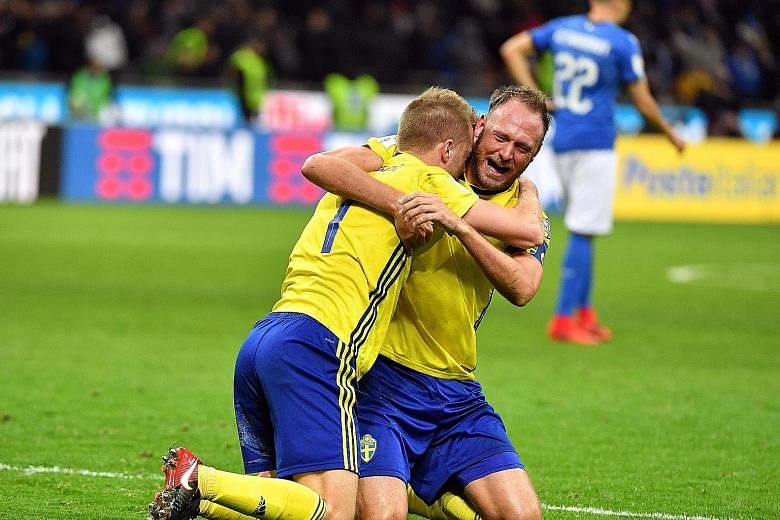 Sweden captain Andreas Granqvist (right) and midfielder Sebastian Larsson celebrating at the San Siro on Monday after securing their passage to Russia 2018 at the expense of four-time world champions Italy.