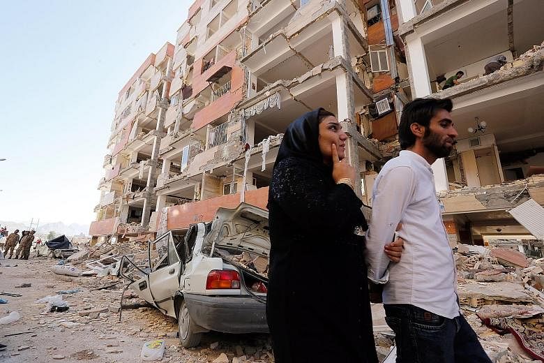 Damaged buildings in Sarpol-e Zahab, one of the hardest-hit towns, in Iran's Kermanshah province following Sunday's earthquake. At least 14 provinces were affected by the quake, which destroyed two whole villages, damaged 30,000 houses and left more 