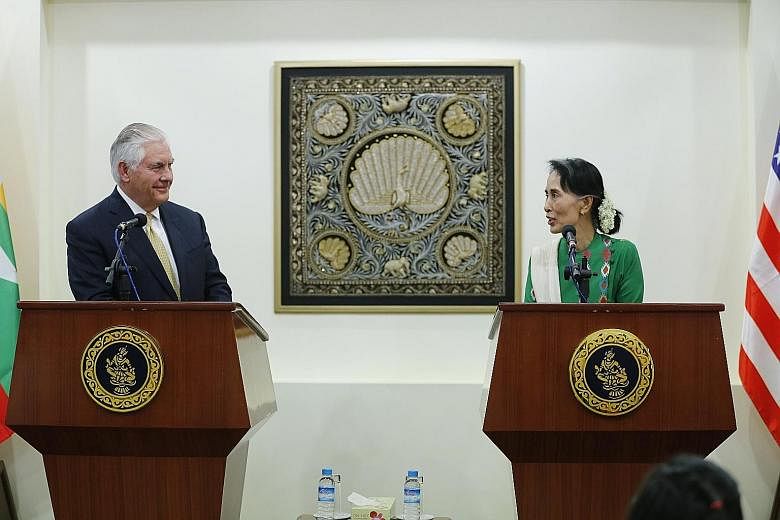 US Secretary of State Rex Tillerson and Myanmar State Counsellor Aung San Suu Kyi at a joint press conference after their meeting in Naypyitaw yesterday. Mr Tillerson said: "We want to see Myanmar succeed. You can't just impose sanctions and say, the