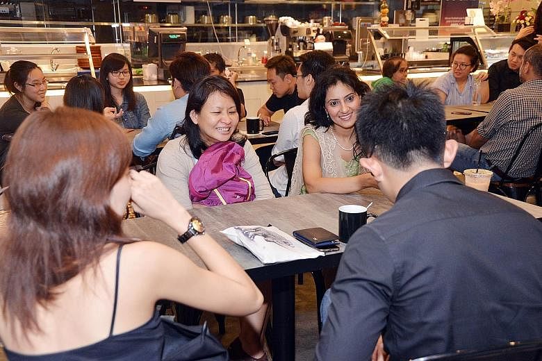 Participants at the Death Cafe, which drew 20 people, including Ms Carol Lim (right foreground). They discussed questions such as "what is death like?" and shared takeaways and personal experiences. Participants sharing their thoughts on death and li