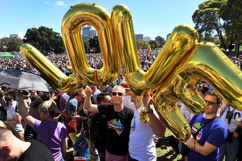 Supporters of same-sex marriage celebrating the results of the national vote in a Sydney park yesterday.The 61.6 per cent vote in favour of marriage equality marks a watershed moment for gay rights in Australia, where it was illegal in some states to
