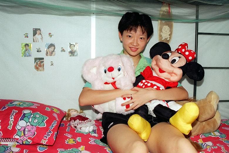 Li Jiawei, then only 15 years old, in her room at the Singapore Table Tennis Association dormitory in 1997. Her parents convinced the Chinese authorities to let her leave the country of her birth to move to Singapore.