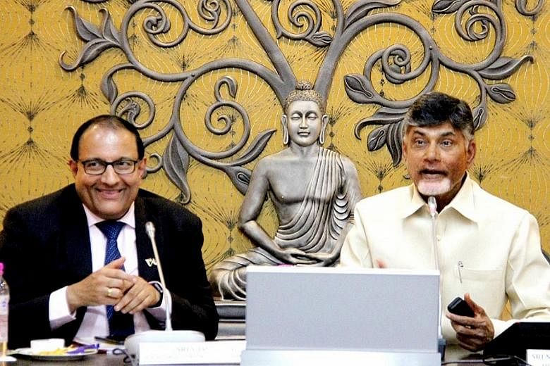 Singapore Minister for Trade and Industry (Industry) S. Iswaran (left) with Andhra Pradesh Chief Minister Chandrababu Naidu in the Indian state yesterday. They hailed the "very good progress" made on Amaravati.
