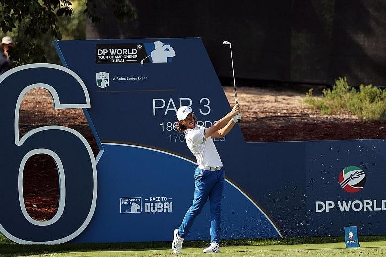 England's Tommy Fleetwood in action in the second round of the DP World Tour Championship at the Jumeirah Golf Estates in Dubai yesterday. He made up for his first-round score with a 65 to put himself back in the Race to Dubai contention.