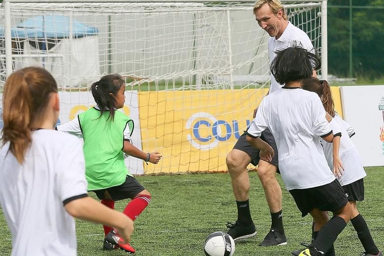 Former Liverpool and Finland defender Sami Hyypia conducting a football clinic for girls, organised by Courts, at The Arena in Woodleigh Park yesterday.