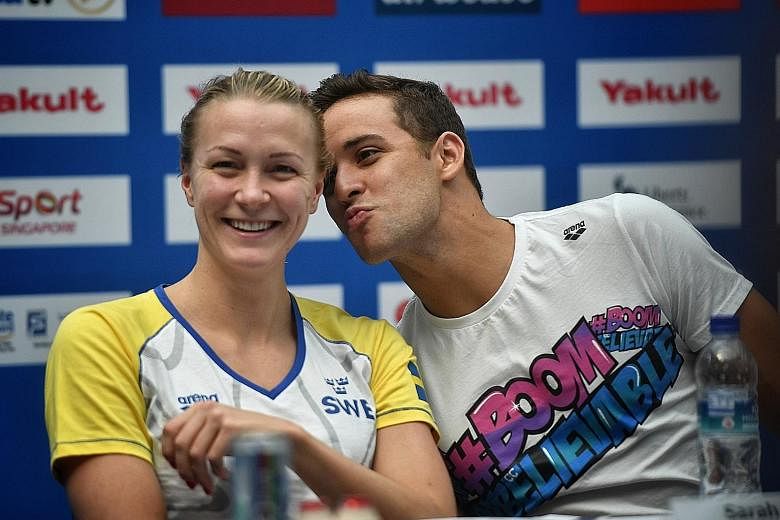 A light-hearted moment for Sweden's Sarah Sjostrom and South Africa's Chad le Clos during the Fina World Cup press conference at Kallang Wave Mall yesterday.