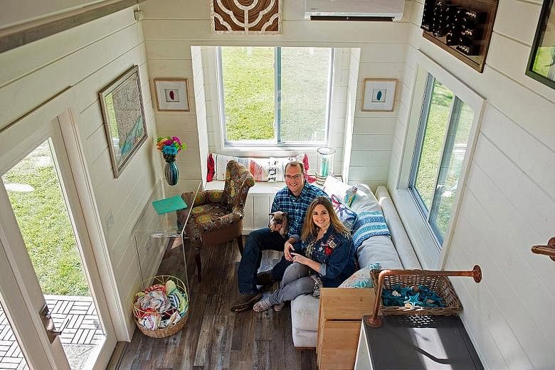 Couple Tori and Ken Pond (above), who own a tiny-house building company called Craft & Sprout, in their model home in their backyard (left).